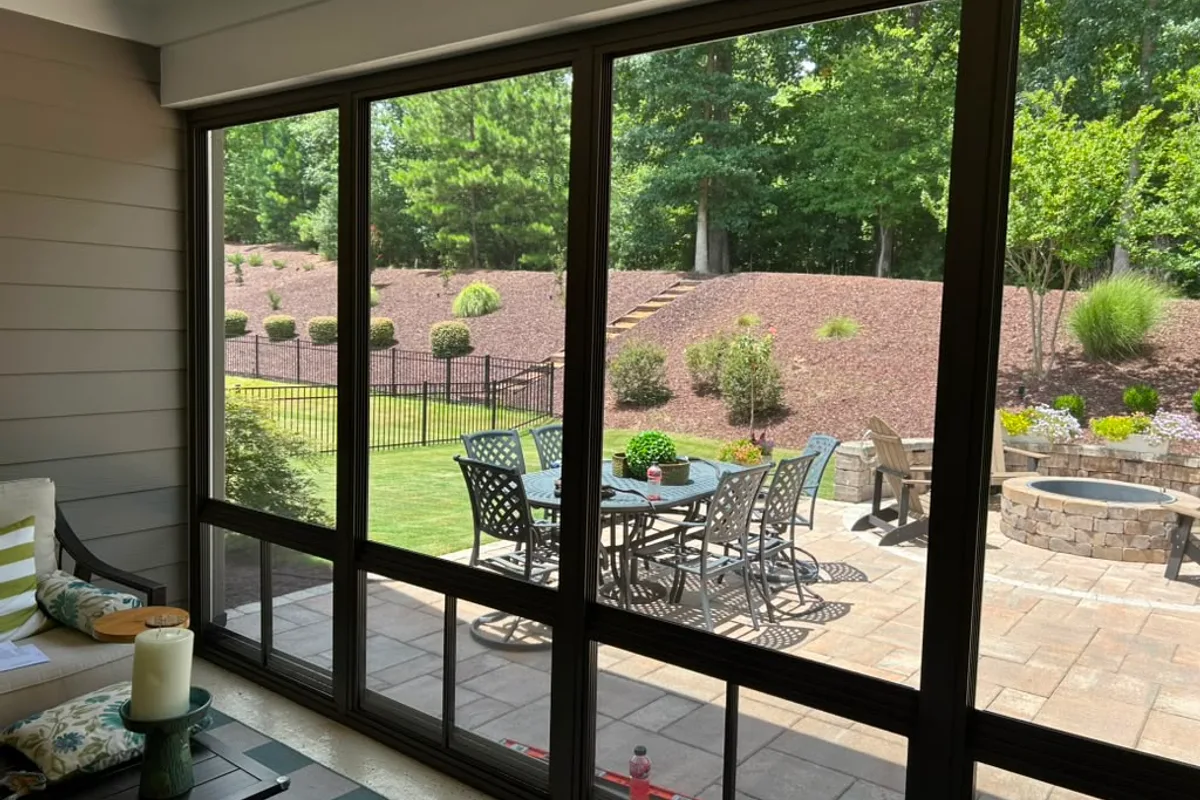 Vinyl film sunroom installation detail showing finished enclosure in Belmont