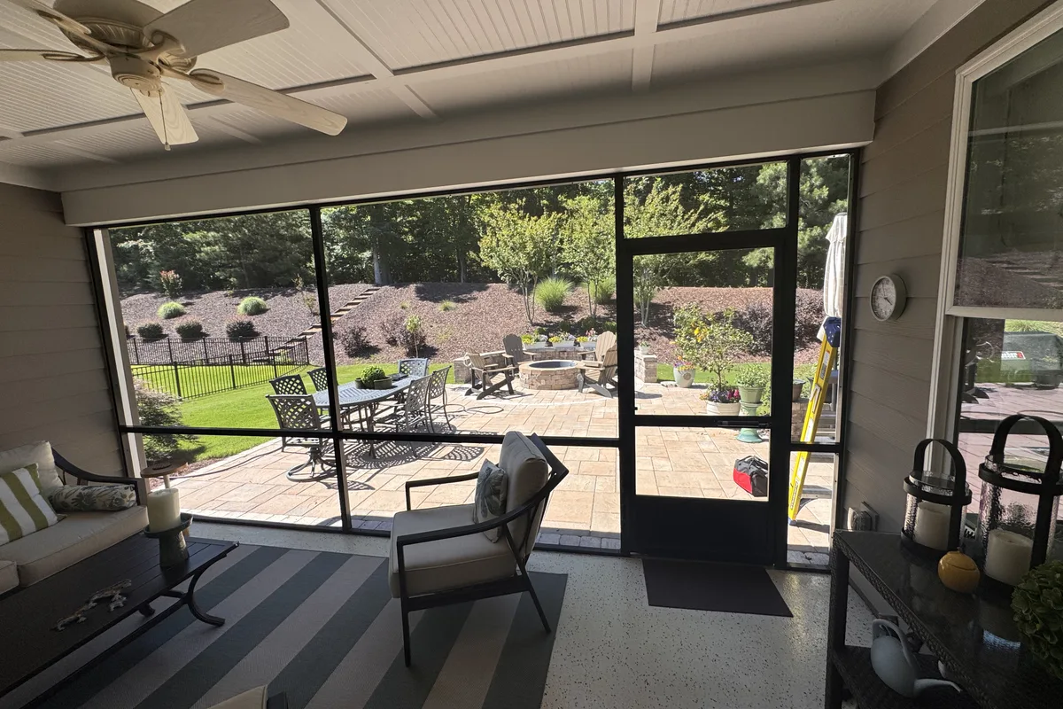 Existing porch structure before 3-season vinyl film enclosure in Belmont NC