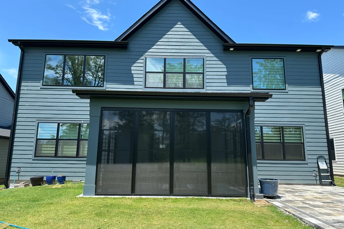 Finished 3-season vinyl film sunroom enclosure exterior in Tega Cay SC